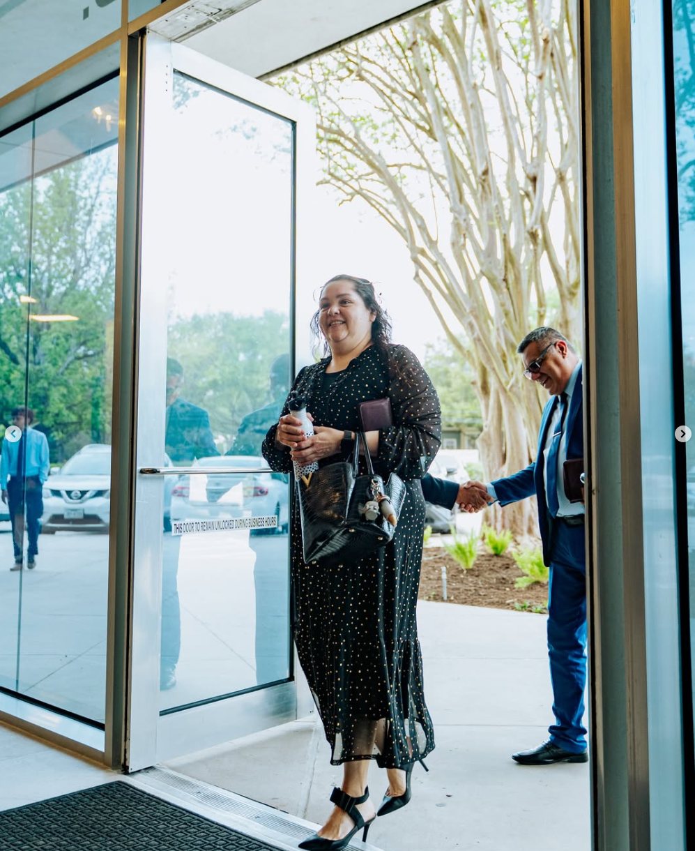 A guest being welcomed at the door