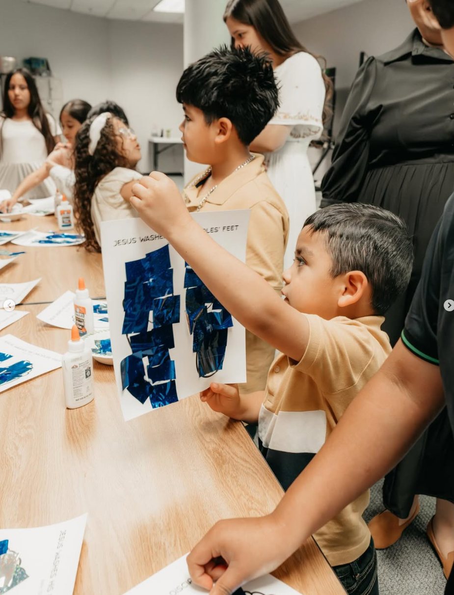 Child showing a kids ministry craft