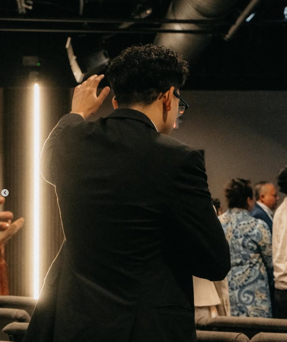 A worshipper raising a hand during service