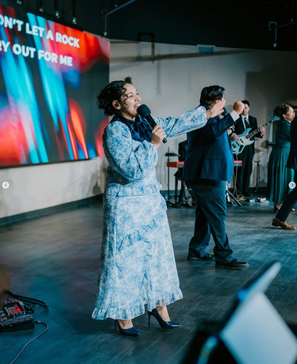 Worship leader singing at CLFC