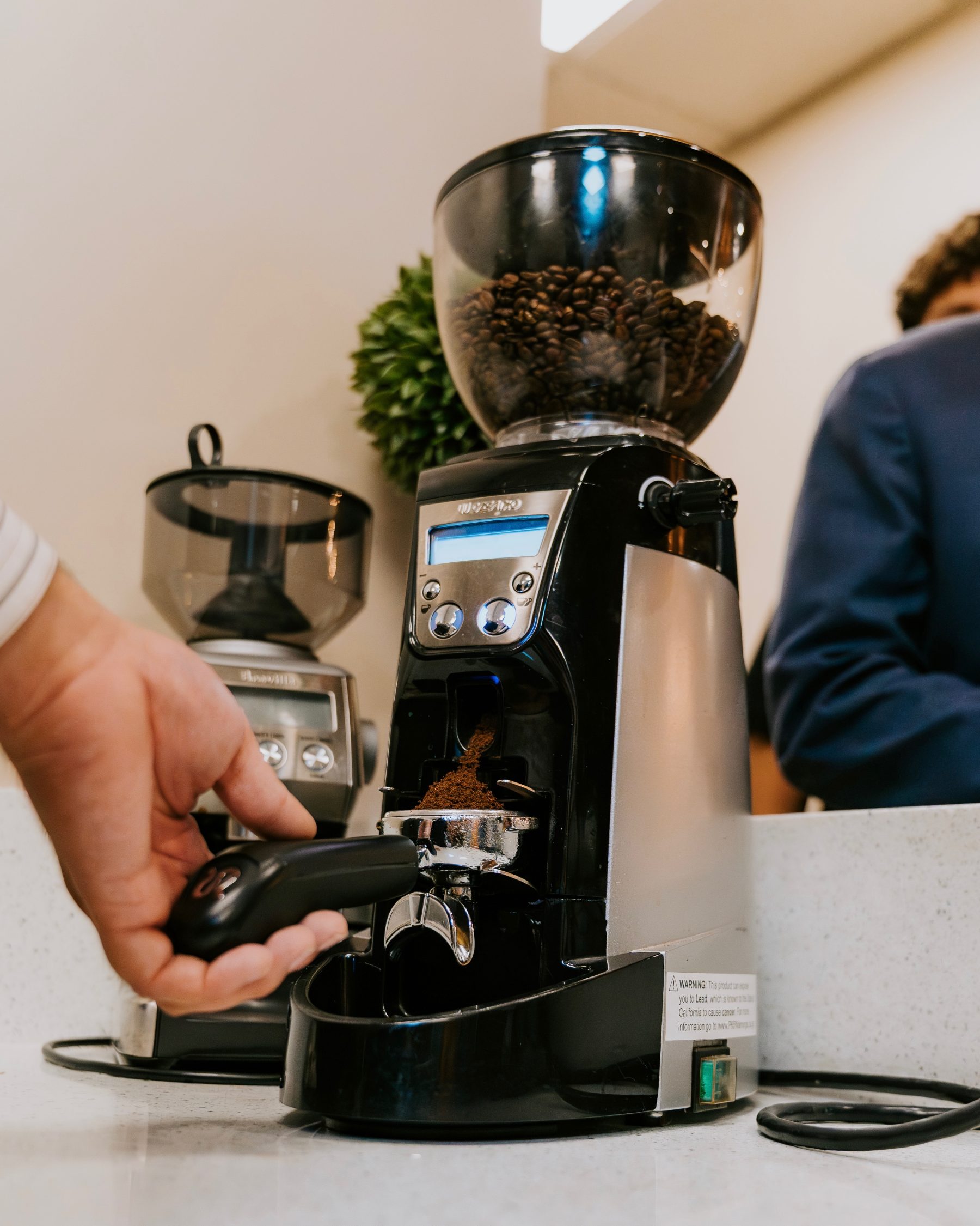 Fresh coffee being ground at Vida Cafe