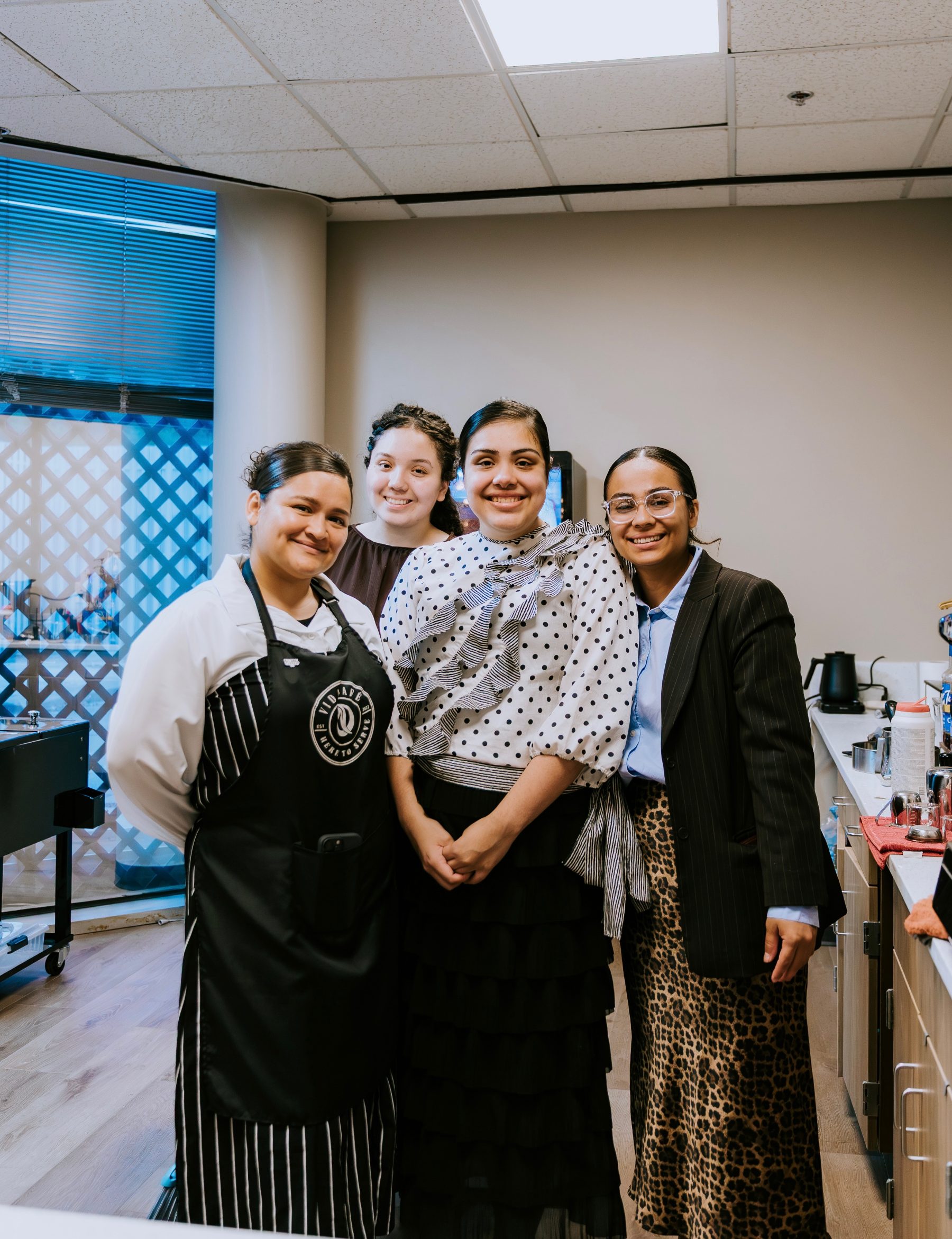 CLFC Vida Cafe team smiling behind the counter